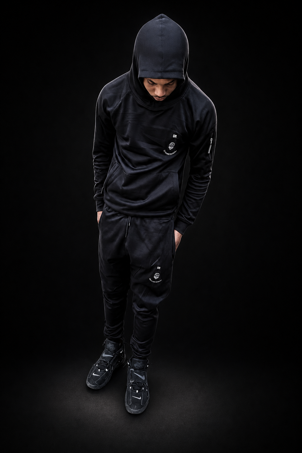 E4R model in all-black hoodie tracksuit set